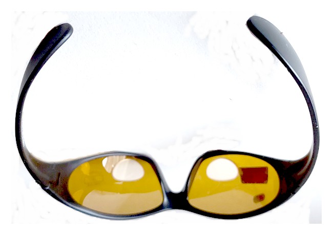 Forward looking view of amber tinted lenses and reading lenses